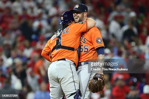 Christian Vazquez and Ryan Pressly of the Houston Astros celebrate a combined no-hitter to defeat the Philadelphia Phillies 5-0 in Game Four of the...