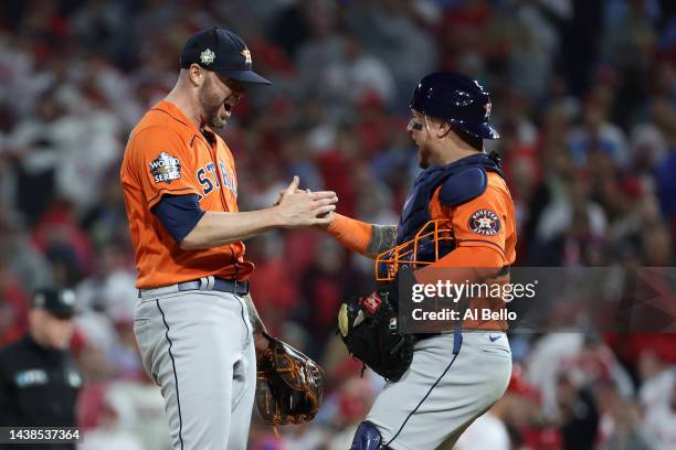 Ryan Pressly ad Christian Vazquez of the Houston Astros celebrate a combined no-hitter to defeat the Philadelphia Phillies 5-0 in Game Four of the...