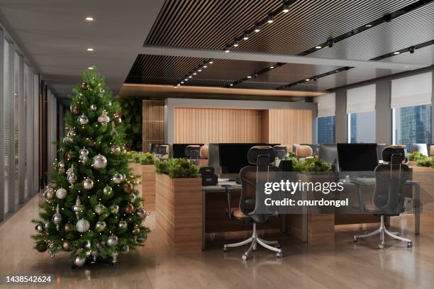 modern open plan office interior with christmas tree, ornaments, and gift boxes - christmas office party stock pictures, royalty-free photos & images