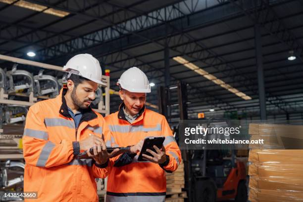 a day at work for a male and female engineers working in a metal manufacturing industry. - software as a service stock pictures, royalty-free photos & images
