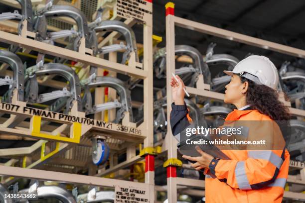 a day at work for a male and female engineers working in a metal manufacturing industry. - chassis stock pictures, royalty-free photos & images