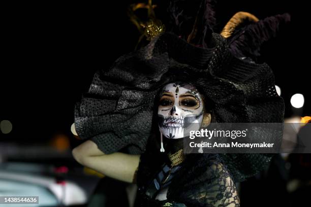 Celebrant dressed as Catrina, Mexico's lady of death who serves as a reminder to enjoy life and embrace mortality, attends the Día De Muertos Camino...