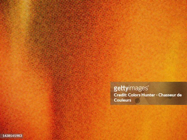 very close-up of a poster in orange tones printed using the offset technique in paris - publicity event stockfoto's en -beelden