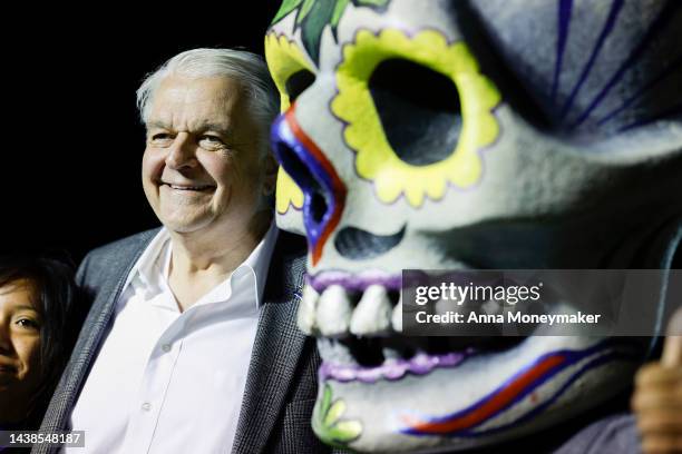 Nevada Gov. Steve Sisolak poses with a supporter wearing a Calavera, which is a representation of a human skull, at the Día De Muertos Camino al...