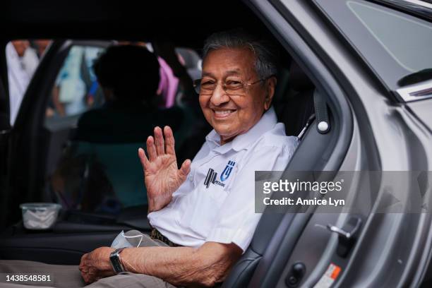 Former Malaysian Prime Minister and founder of the Gerakan Tanah Air coalition Mahathir Mohamad reacts as he leaves a candidate announcement ceremony...