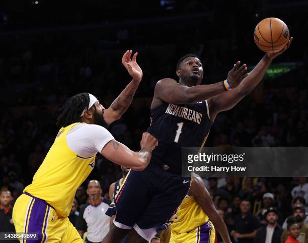 Zion Williamson of the New Orleans Pelicans scores on a layup past Anthony Davis of the Los Angeles Lakers during a 120-117 Lakers win at Crypto.com...