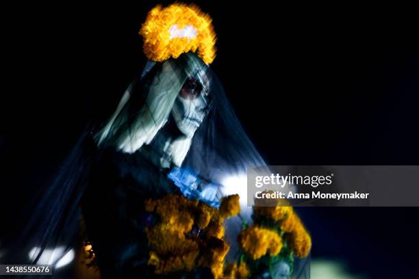 Celebrants dressed up as Catrinas, Mexico's lady of death who serves as a reminder to enjoy life and embrace mortality, compete for title of the best...