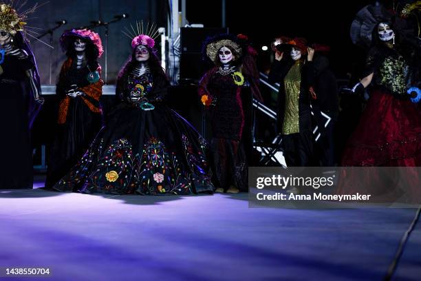 Celebrants dressed up as Catrinas, Mexico's lady of death who serves as a reminder to enjoy life and embrace mortality, compete for title of the best...