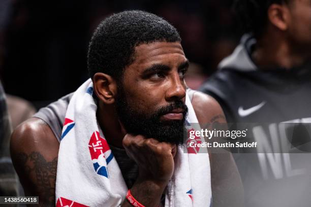 Kyrie Irving of the Brooklyn Nets looks on from the bench during the second quarter of the game against the Chicago Bulls at Barclays Center on...