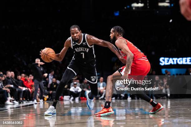 Kevin Durant of the Brooklyn Nets is guarded by Derrick Jones Jr. #5 of the Chicago Bulls during the third quarter of the game at Barclays Center on...