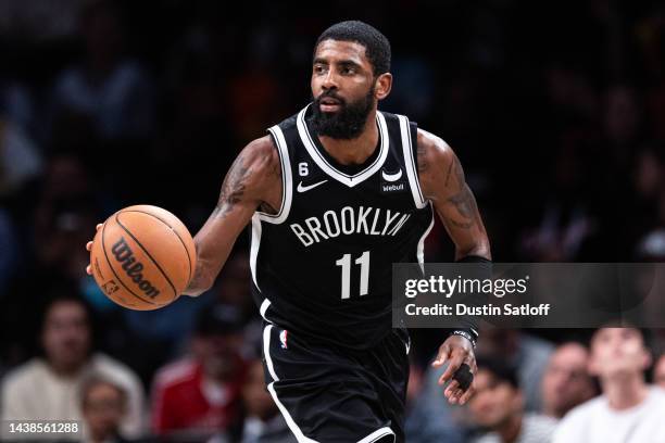 Kyrie Irving of the Brooklyn Nets looks brings the ball up the court during the fourth quarter of the game against the Chicago Bulls at Barclays...