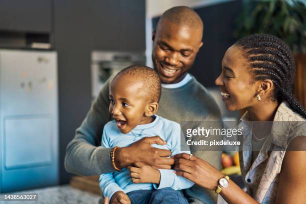 black family, father and mother hug child, happy together at home, spending quality time and bonding. black woman, man and kid, fun and love, playful and childhood, parents and son laughing. - 3 hours stock pictures, royalty-free photos & images