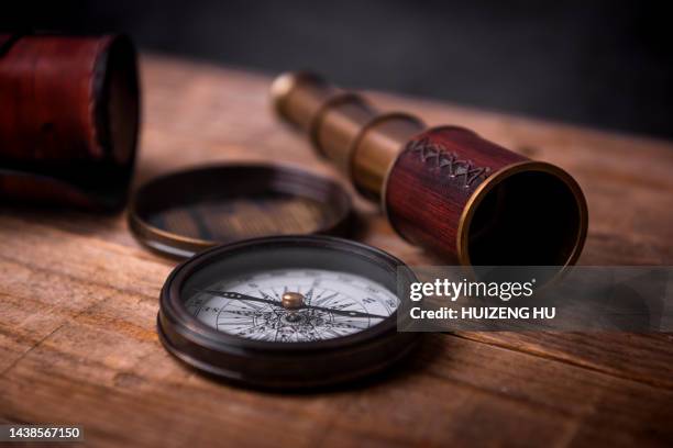 vintage telescope and compass - vintage compass drawing stock pictures, royalty-free photos & images