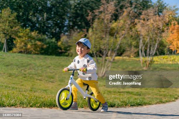 baby - tricycle stock pictures, royalty-free photos & images