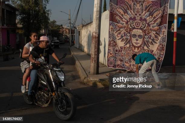 Local vendors sell from pop up shops during 'Day of the Dead' celebrations on November 2, 2022 at San Andrés Mixquic graveyard in the outskirts of...