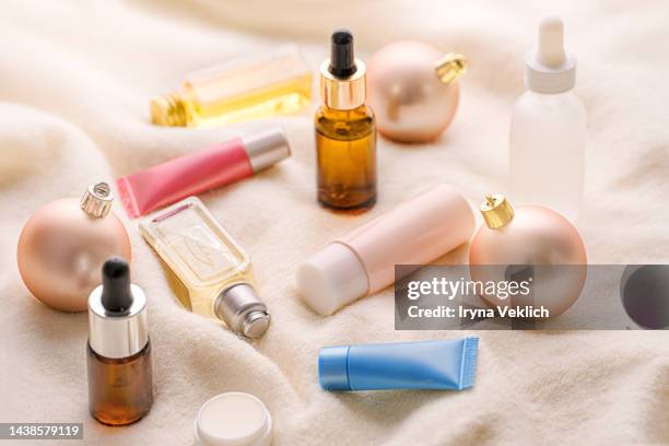 merry christmas, happy new year beauty products gift concept. - ribbon worm stock pictures, royalty-free photos & images