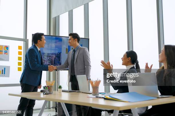 employees are meeting at office. - southeast asia stock pictures, royalty-free photos & images
