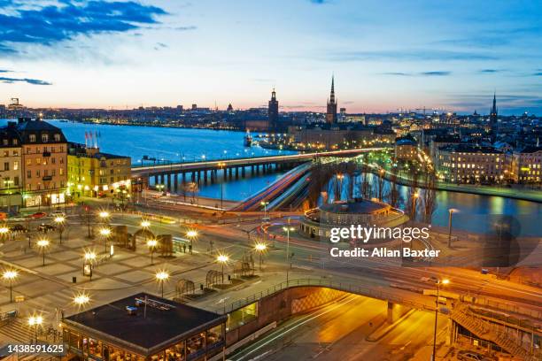 elevated skyline of stockholm illuminated at dusk - stockholm skyline stock pictures, royalty-free photos & images