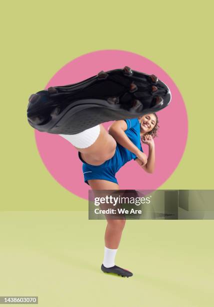 portrait of footballer kicking to camera - karate woman stock pictures, royalty-free photos & images