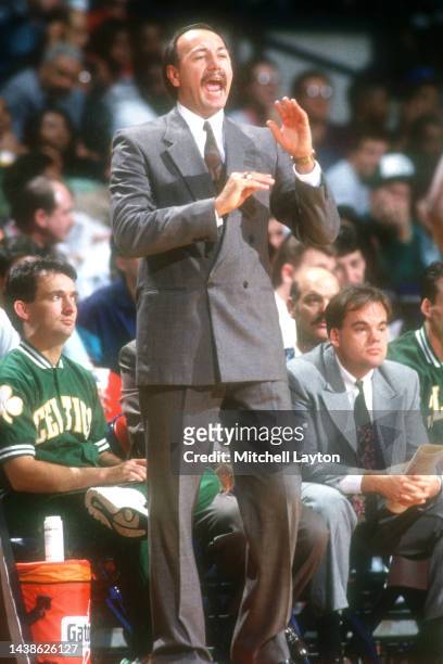 Head coach Chris Ford of the Boston Celtics signals to his players during a basketball game against the Washington Bullets at the Capitol Centre on...