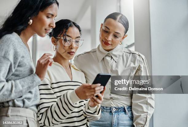 startup, business and women on smartphone reading email on mobile app, social media post update or website marketing strategy together. entrepreneur team using phone for feedback or online review - newsletter stockfoto's en -beelden