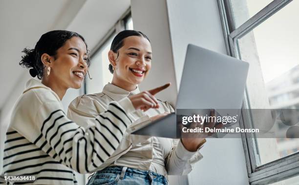 laptop, planning and startup business women team for website design, social media marketing or email communication success. empowerment entrepreneur people reading career newsletter or blog update - looking over laptop stock pictures, royalty-free photos & images