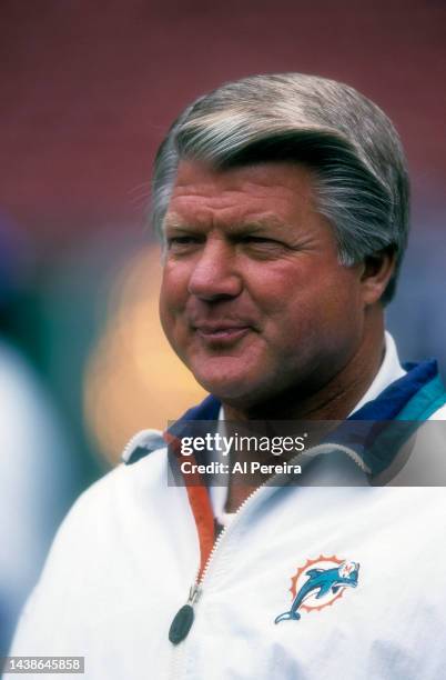 Head Coach Jimmy Johnson of the Miami Dolphins follows the play in the game between The Miami Dolphins vs The New York Jets at The Meadowlands on...