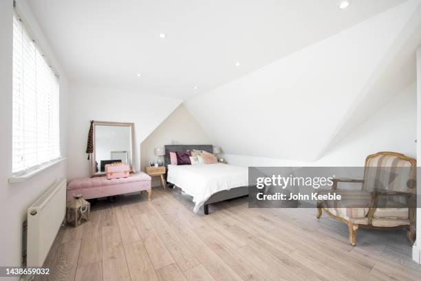 property bedroom interiors - wood laminate flooring stock pictures, royalty-free photos & images