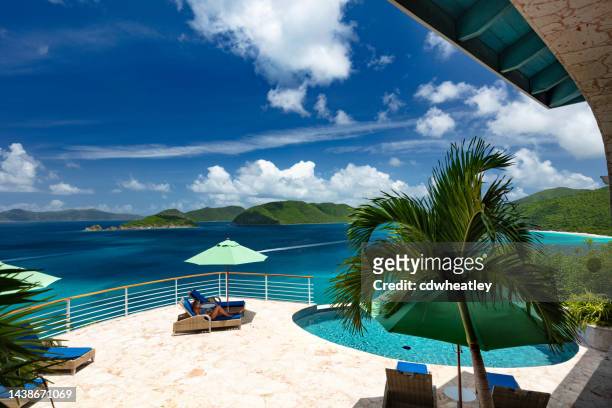 woman at luxury villa - caribbean resort stock pictures, royalty-free photos & images