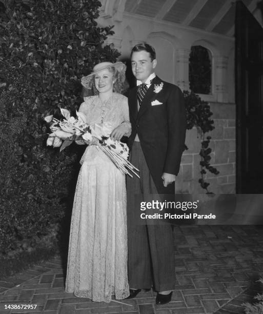 American actress, singer and dancer Ginger Rogers and American actor Lew Ayres after their wedding ceremony at the Little Church Of The Flowers, in...
