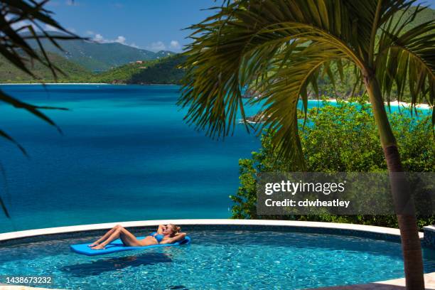 woman at luxury villa - heavenly resort stock pictures, royalty-free photos & images