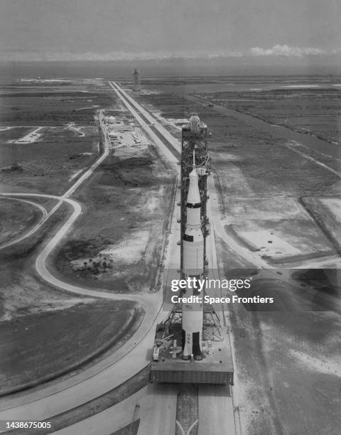 Top-to-bottom view of the Apollo 11 Saturn V super heavy-lift launch vehicle as a fuelling exercise is conducted during rollout on its mobile...