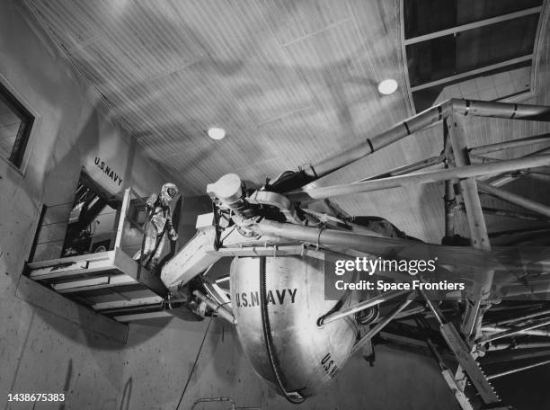 American NASA astronaut Wally Schirra , Project Mercury astronaut, prepares to enter the pill-shaped gondola of the Aviation Medical Acceleration...