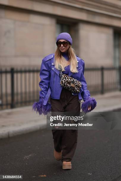 Sonia Lyson seen wearing Ugg plateau platform Ultra Mini beige boots, Storets brown destroyed jogging pants, Storets lilac leather jacket with...