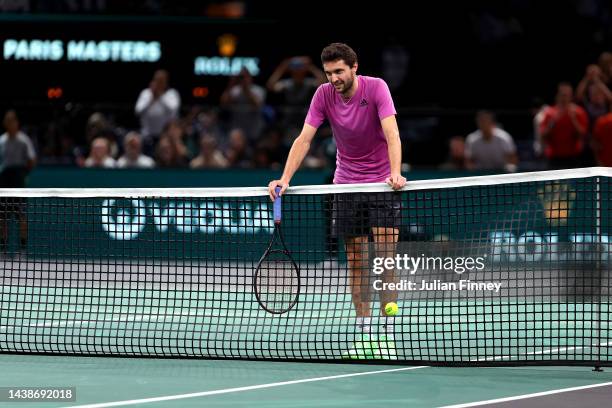 Gilles Simon of France reacts at the net after being defeated in their round of 16 singles match by Felix Auger Aliassime of Canada during Day Four...
