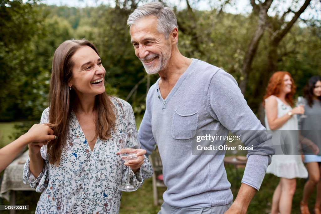 Happy man and woman having an outdoor celebration