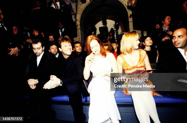 Jon Bon Jovi, actress Melanie Griffith, and guests This is the first collection designed solely by Donatella Versace, after the death of her brother...