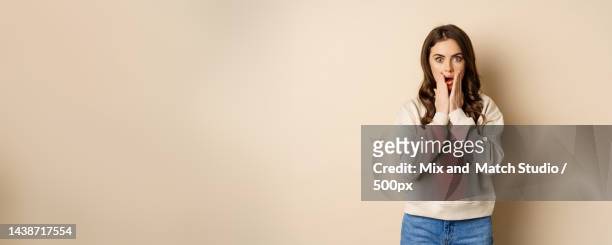 portrait of shocked brunette woman drop jaw,gasping and staring - gasping stock pictures, royalty-free photos & images