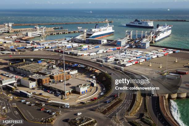 heavy goods vehicles waiting to board ferry at port of dover in uk - brexit stockfoto's en -beelden