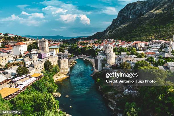 view of the city of mostar and its old bridge (stari most). bosnia. balkan countries. - bosnia and hercegovina stockfoto's en -beelden