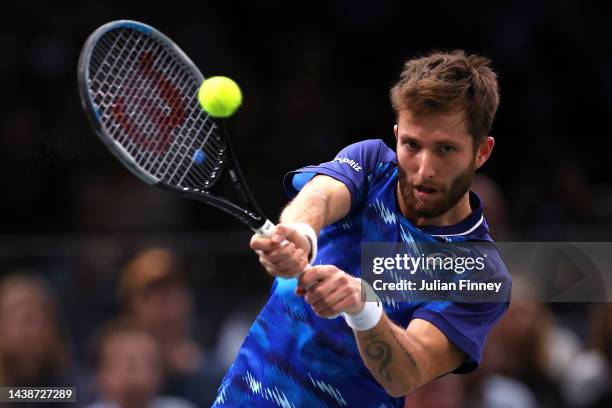 Corentin Moutet of France plays a backhand in their round of 16 singles match against Stefanos Tsitsipas of Greece during Day Four of the Rolex Paris...