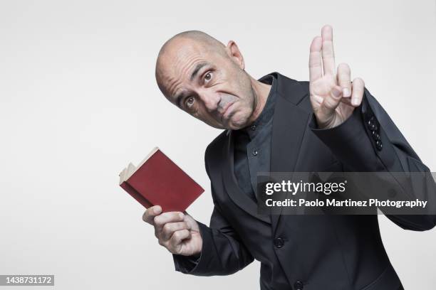 perplexed priest - oblivious stock pictures, royalty-free photos & images