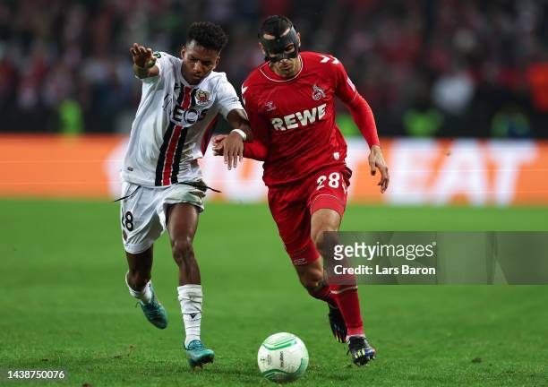 Hicham Boudaoui of OGC Nice challenges Ellyes Skhiri of 1.FC Koln during the UEFA Europa Conference League group E match between 1. FC Köln and OGC...