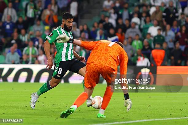 Nabil Fekir of Real Betis scores their sides third goal past Conor Hazard of HJK Helsinki during the UEFA Europa League group C match between Real...
