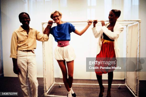 Designer Willi Smith with models Denise Flamino and Toukie Smith in looks from his spring 1979 collection