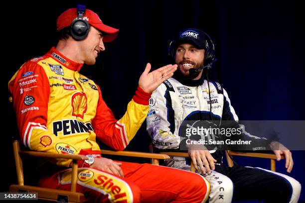 Ross Chastain, driver of the Moose Fraternity Chevrolet, and Joey Logano, driver of the Shell Pennzoil Ford, talk during a roundtable discussion at...