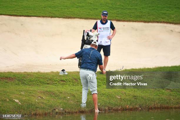 Kyle Westmoreland of United States steps on the pond to make a shot onto the third green during the first round of the World Wide Technology...