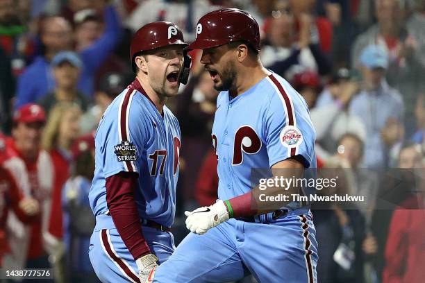 Kyle Schwarber of the Philadelphia Phillies celebrates his home run with teammate Rhys Hoskins during the first inning against the Houston Astros in...