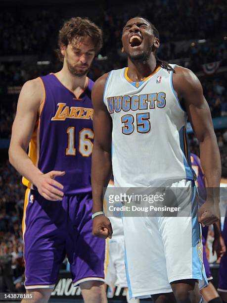 Kenneth Faried of the Denver Nuggets celebrates as Pau Gasol of the Los Angeles Lakers looks on as the Nuggets defeated the Lakers 99-84 in Game...