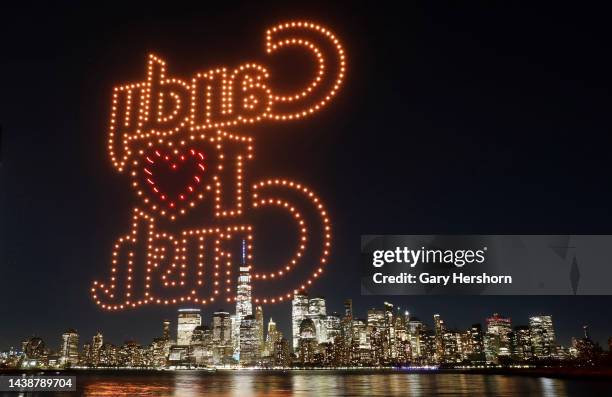 The word Candy Crush is created by 500 drones over the skyline of lower Manhattan and One World Trade Center during an advertising promotion for the...